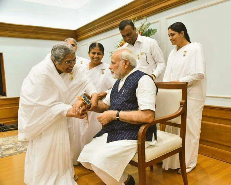 BK Asha Behn tying Rakhi to Narendra Modi  Hon'ble PM
